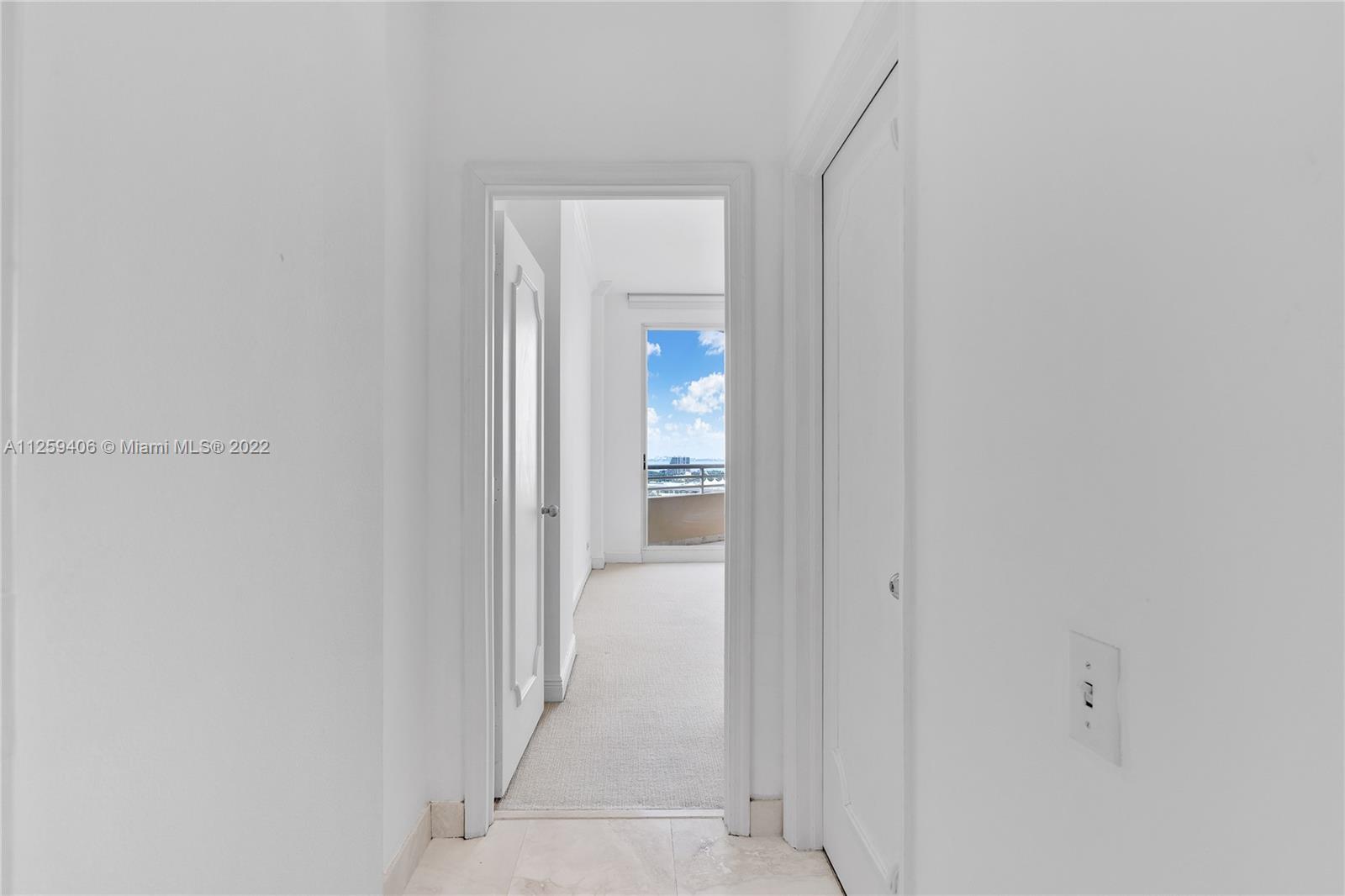 888 Brickell Key Drive, Unit 2610 Miami, FL 33131 - Photo 18 of 31 a view of a bathroom from a hallway