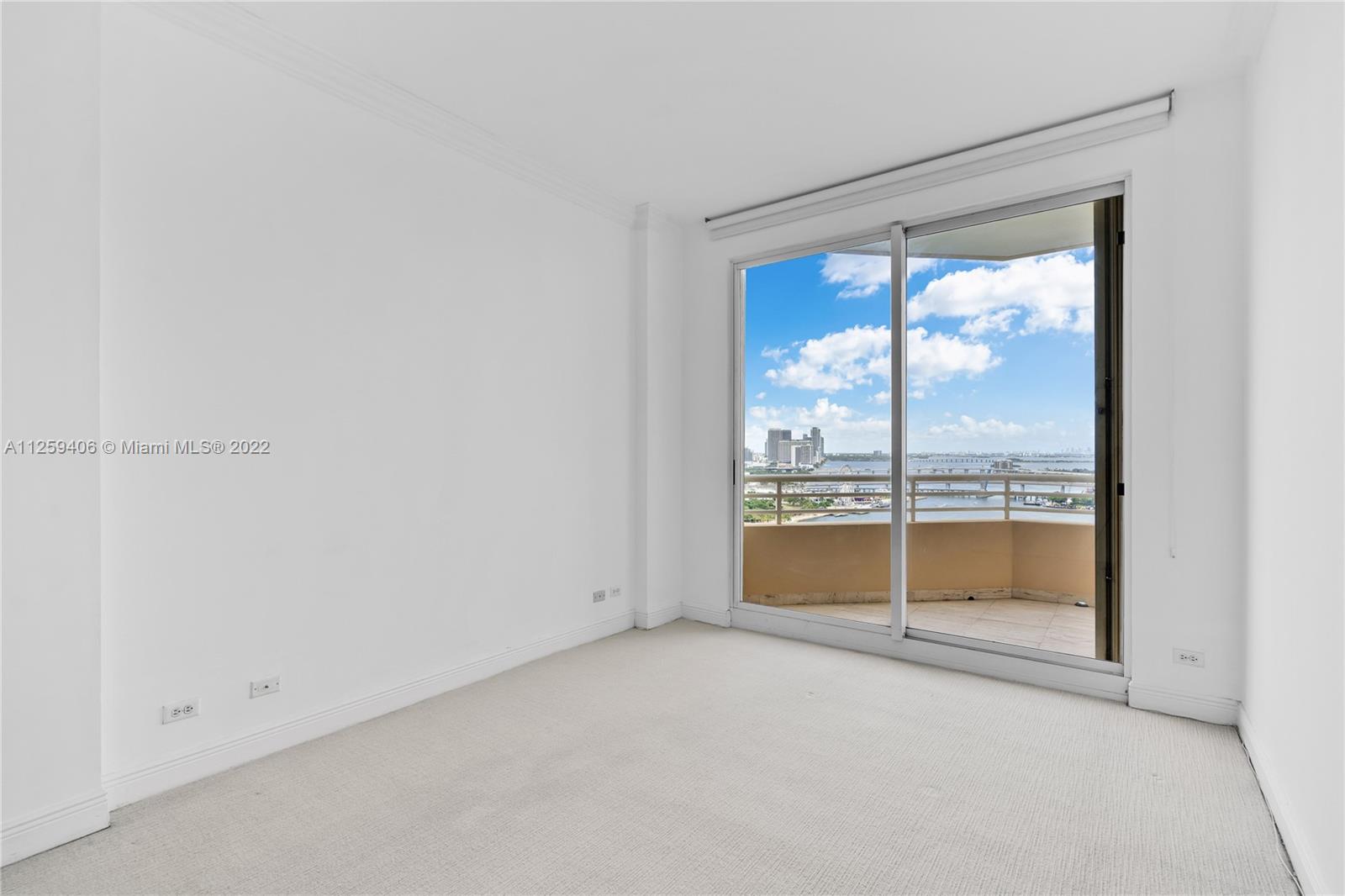 888 Brickell Key Drive, Unit 2610 Miami, FL 33131 - Photo 19 of 31 an empty room with a large window