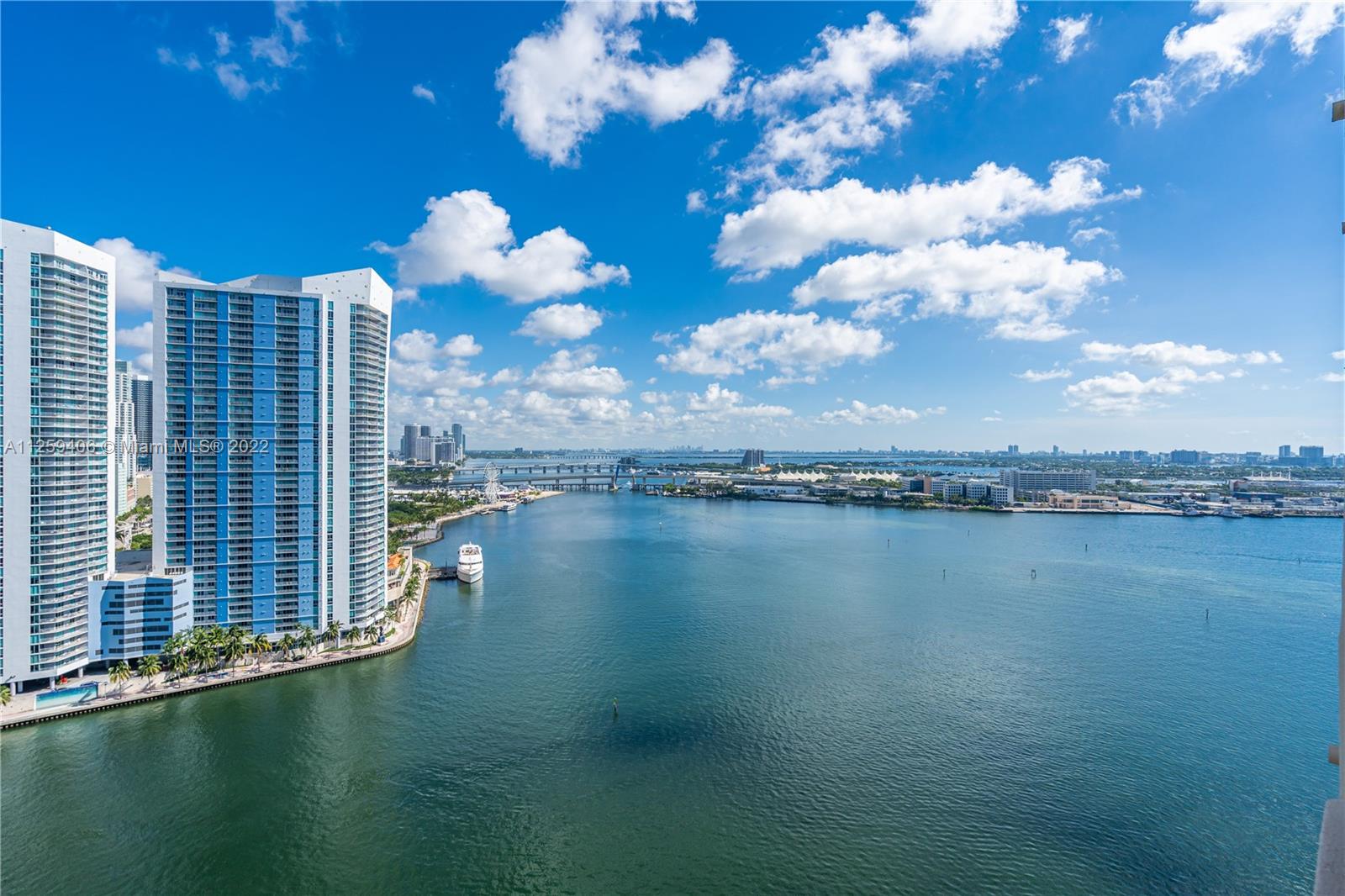 888 Brickell Key Drive, Unit 2610 Miami, FL 33131 - Photo 23 of 31 a view of a city with large pool and outdoor space