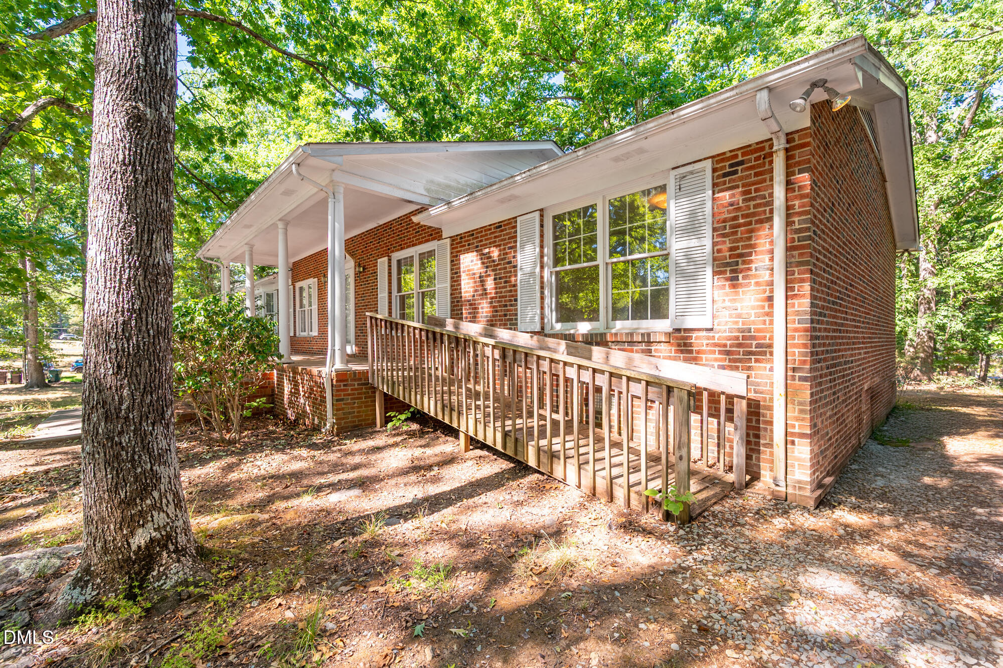 4411 Rhew Drive Durham, NC 27704 - Photo 4 of 34 a view of a house with a small yard and wooden fence