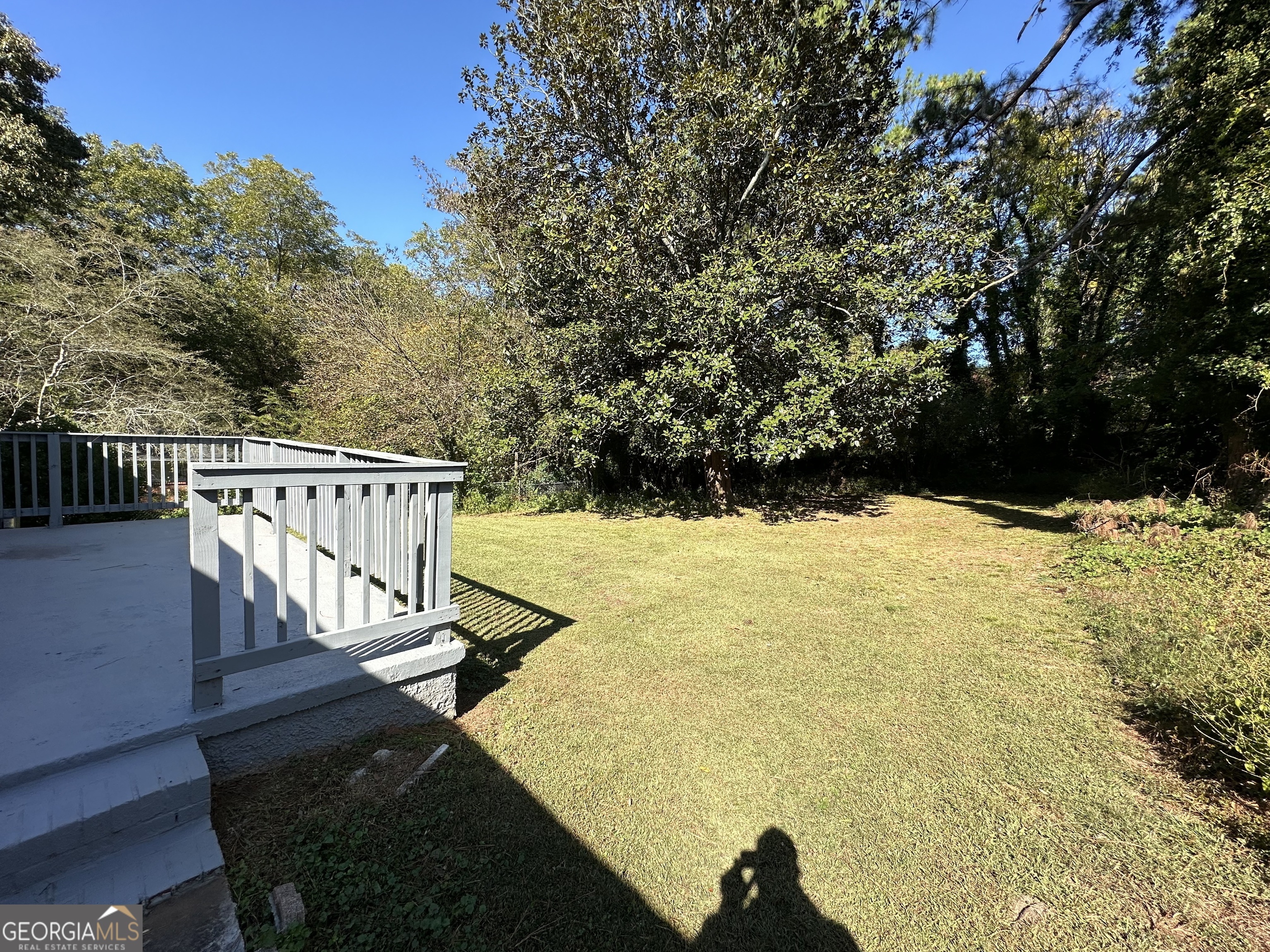 2164 Rockhaven Circle Decatur, GA 30032 - Photo 14 of 17 a view of balcony with wooden floor and outdoor seating