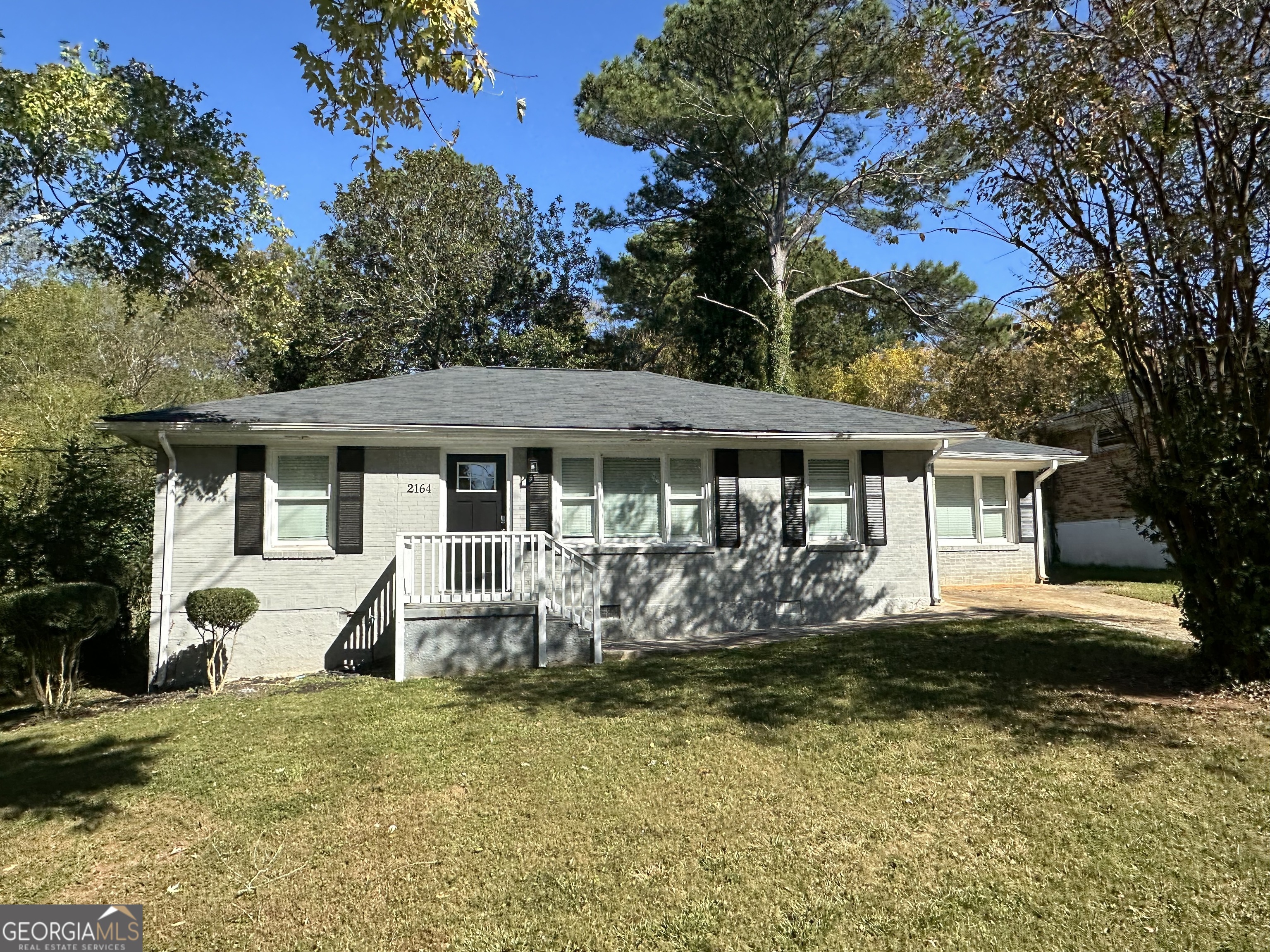 2164 Rockhaven Circle Decatur, GA 30032 - Photo 2 of 17 a front view of house with yard and trees around