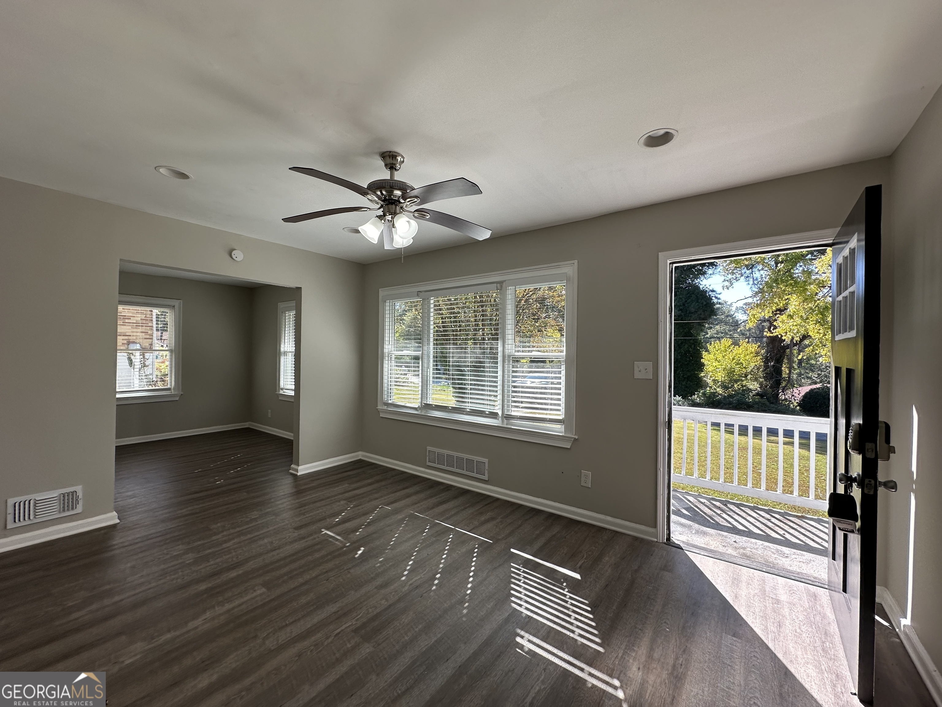 2164 Rockhaven Circle Decatur, GA 30032 - Photo 4 of 17 a view of a livingroom with wooden floor and a ceiling fan