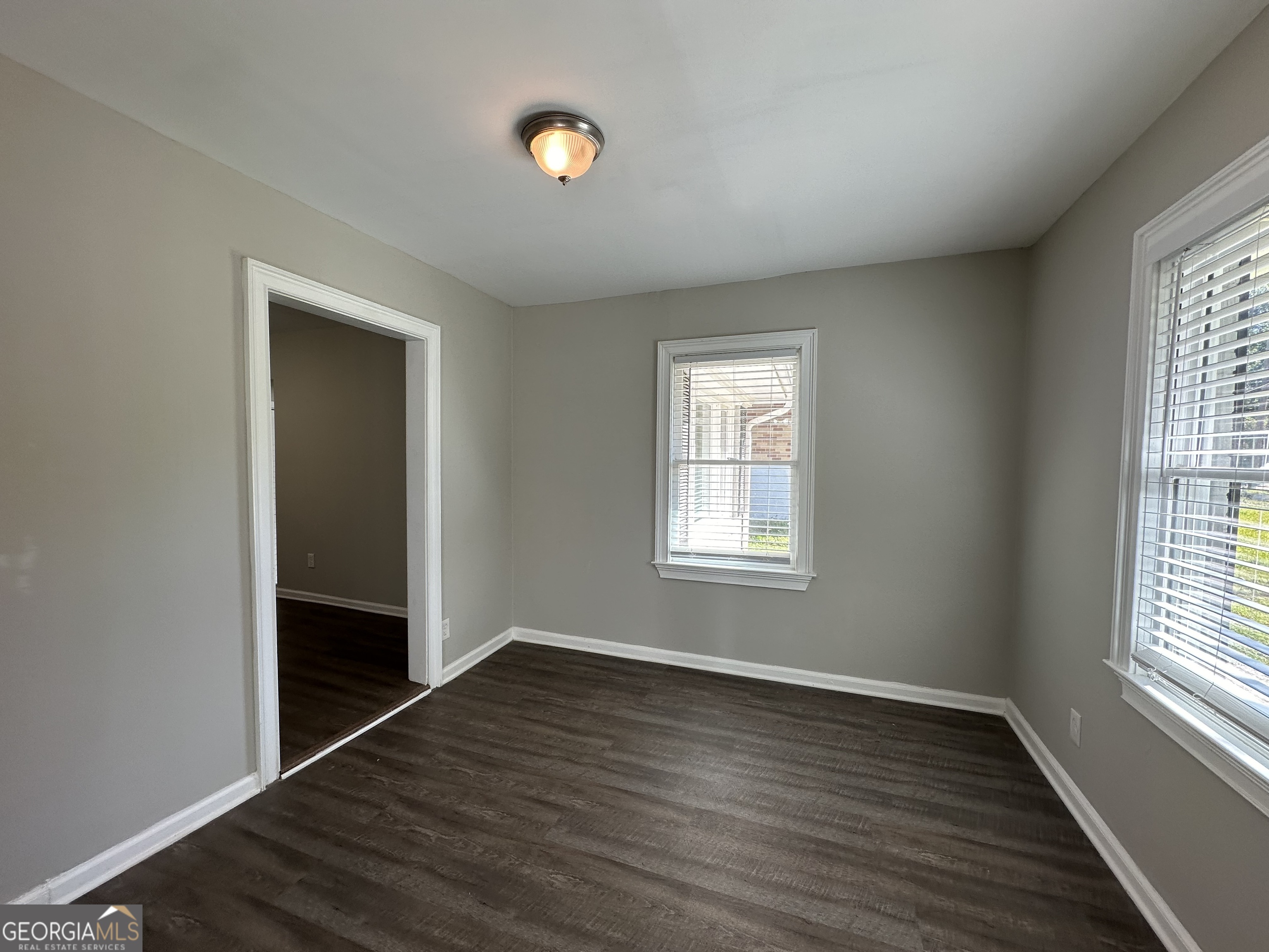 2164 Rockhaven Circle Decatur, GA 30032 - Photo 5 of 17 an empty room with wooden floor and windows