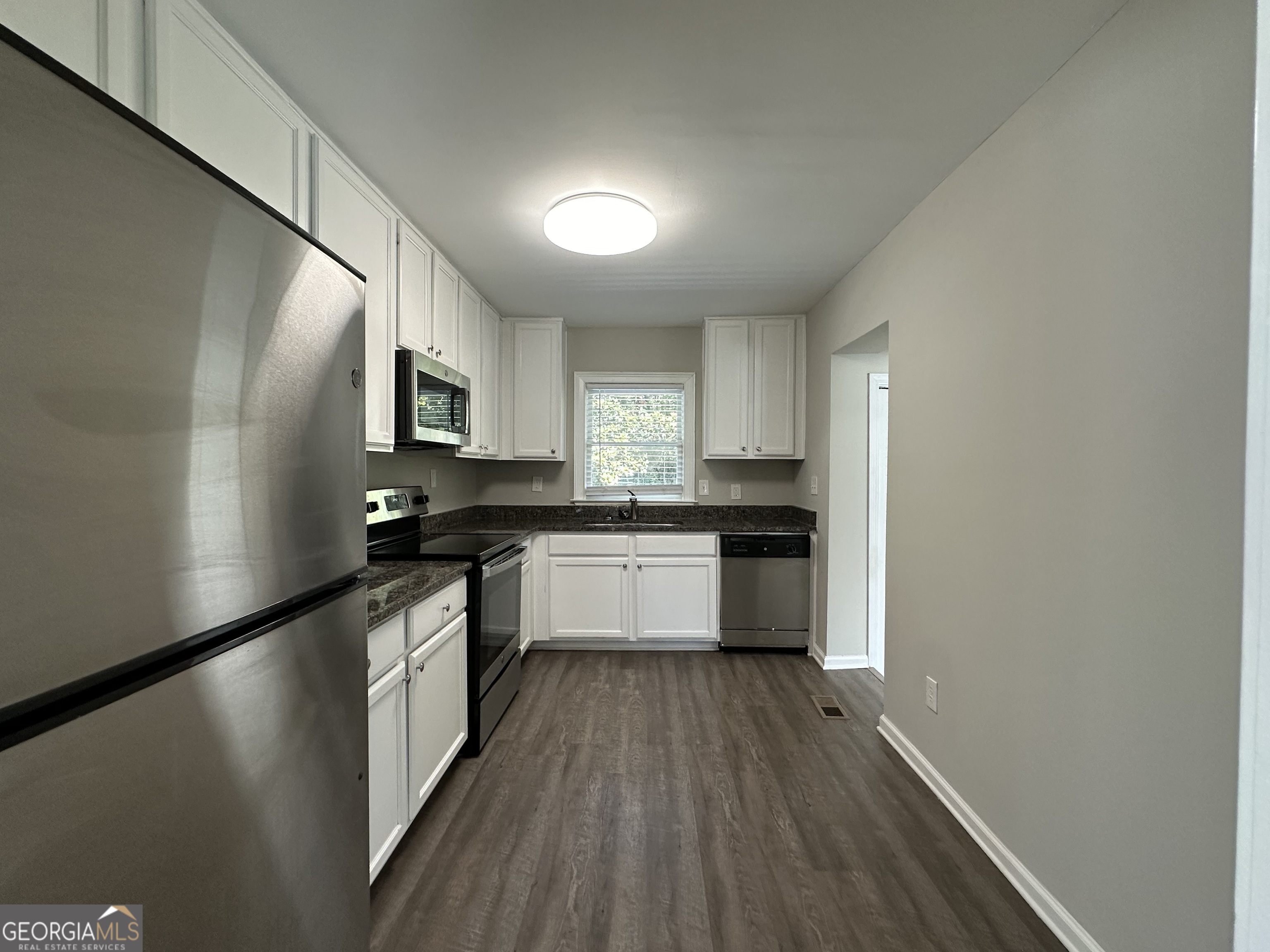 2164 Rockhaven Circle Decatur, GA 30032 - Photo 6 of 17 a kitchen with a refrigerator and a sink
