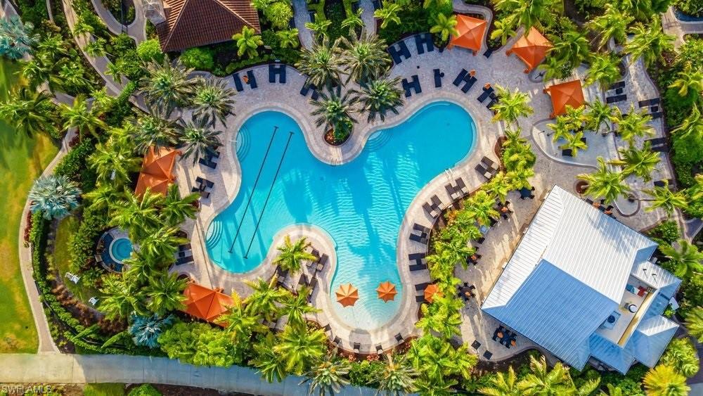 9419 Benvenuto Court, Unit 204 Naples, FL 34119 - Photo 1 of 50 Drone / aerial view of a pool area