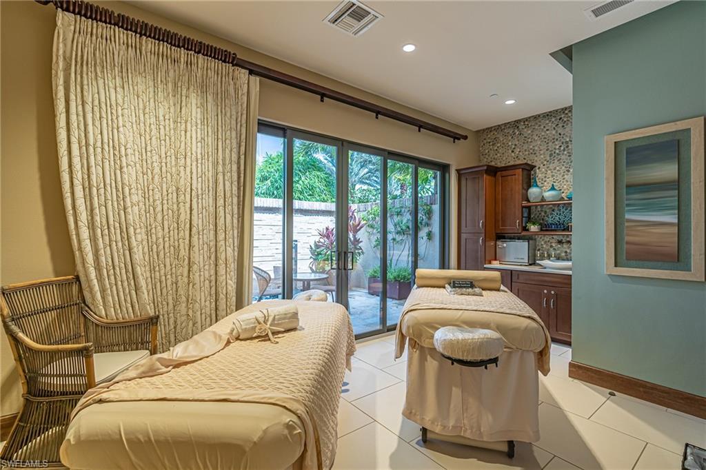 9419 Benvenuto Court, Unit 204 Naples, FL 34119 - Photo 12 of 50 Living area featuring light tile patterned flooring and recessed lighting