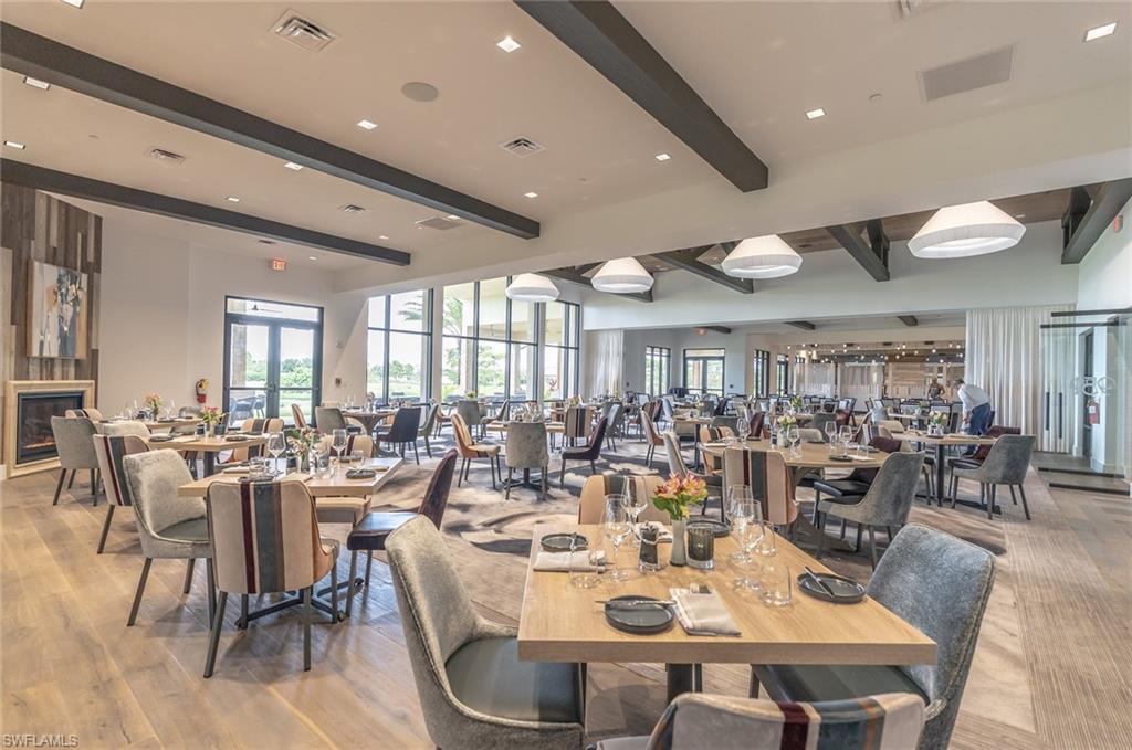 9419 Benvenuto Court, Unit 204 Naples, FL 34119 - Photo 13 of 50 Dining room featuring beamed ceiling and light wood-style floors