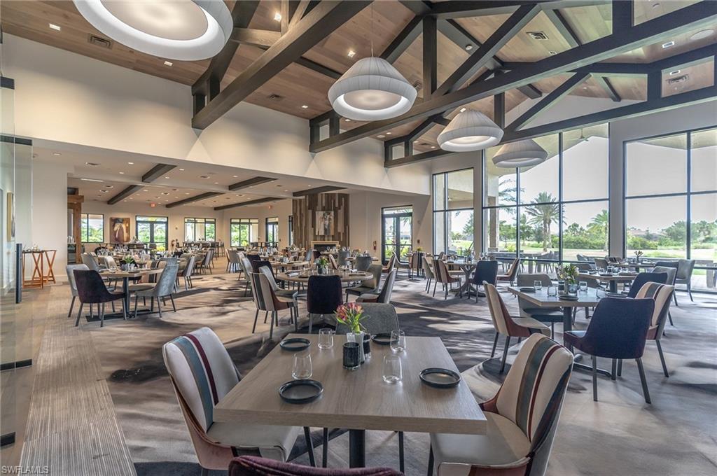 9419 Benvenuto Court, Unit 204 Naples, FL 34119 - Photo 14 of 50 Dining space featuring beamed ceiling, a high ceiling, and recessed lighting