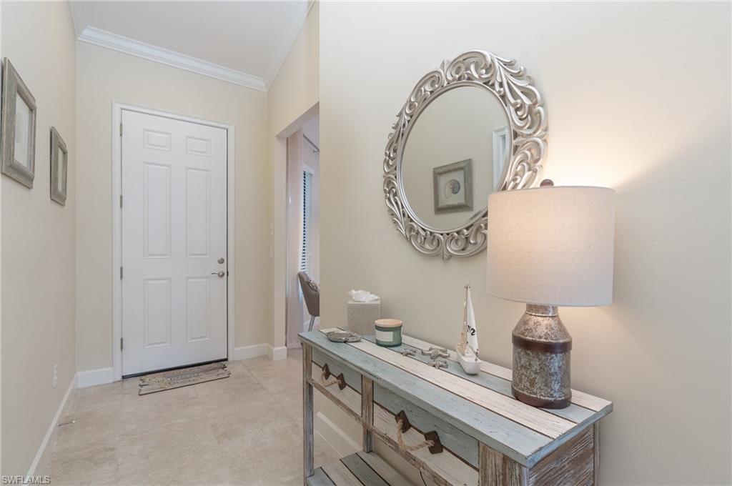 9419 Benvenuto Court, Unit 204 Naples, FL 34119 - Photo 19 of 50 Entryway with baseboards and ornamental molding