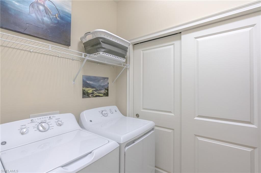 9419 Benvenuto Court, Unit 204 Naples, FL 34119 - Photo 29 of 50 Washroom with separate washer and dryer