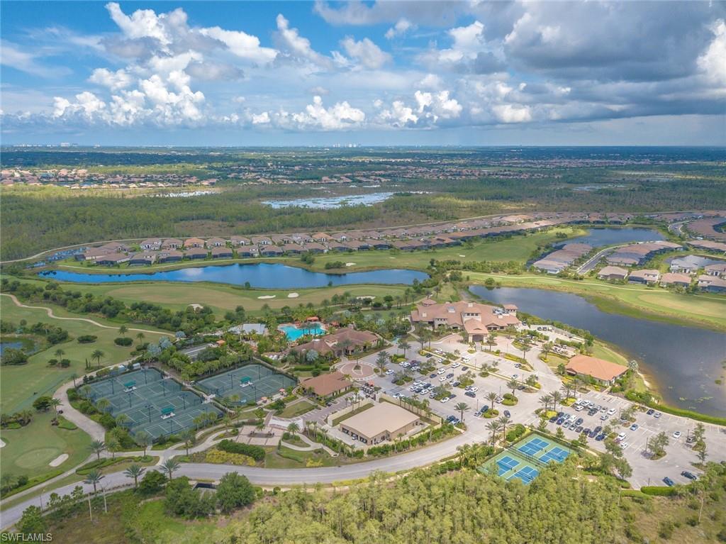 9419 Benvenuto Court, Unit 204 Naples, FL 34119 - Photo 44 of 50 Aerial view of property's location featuring nearby suburban area and a large body of water