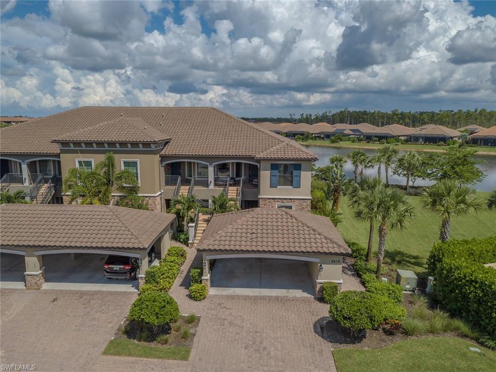 9419 Benvenuto Court, Unit 204 Naples, FL 34119 - Photo 45 of 50 Mediterranean / spanish-style home featuring stone siding, stucco siding, a residential view, and a tile roof