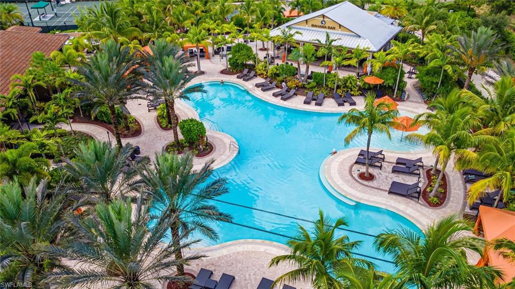 9419 Benvenuto Court, Unit 204 Naples, FL 34119 - Photo 6 of 50 Community pool with a patio