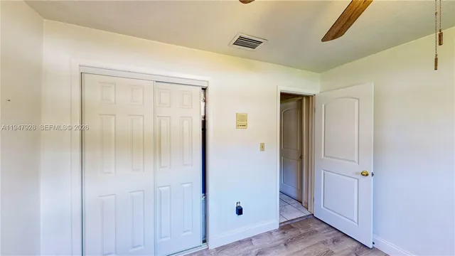 a kitchen with stainless steel appliances granite countertop a sink a stove and a wooden cabinets
