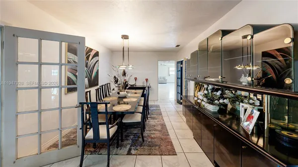 a kitchen with kitchen island granite countertop lots of counter top space and cabinets
