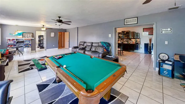 a living room with furniture and a table