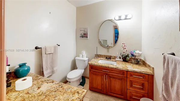 a bed room with a bed and a chair