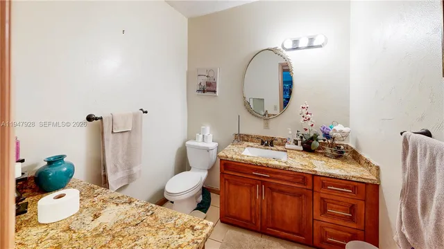 a bed room with a bed and a chair