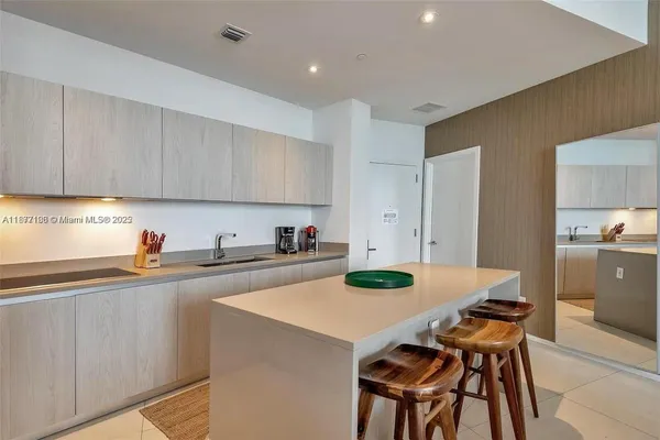 a view of kitchen with dining table and chairs