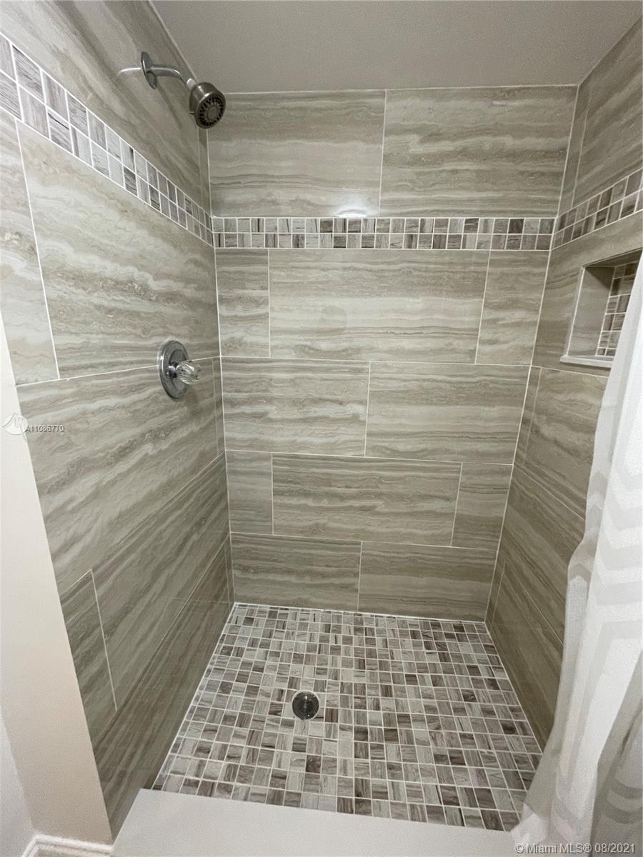 6700 Cypress Road, Unit 105 Plantation, FL 33317 - Photo 16 of 26 a bathroom with a shower