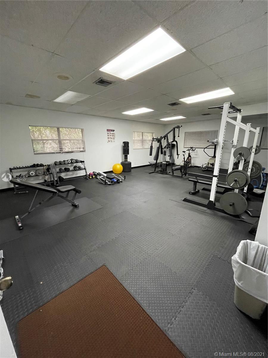 6700 Cypress Road, Unit 105 Plantation, FL 33317 - Photo 22 of 26 a view of a room with gym equipment