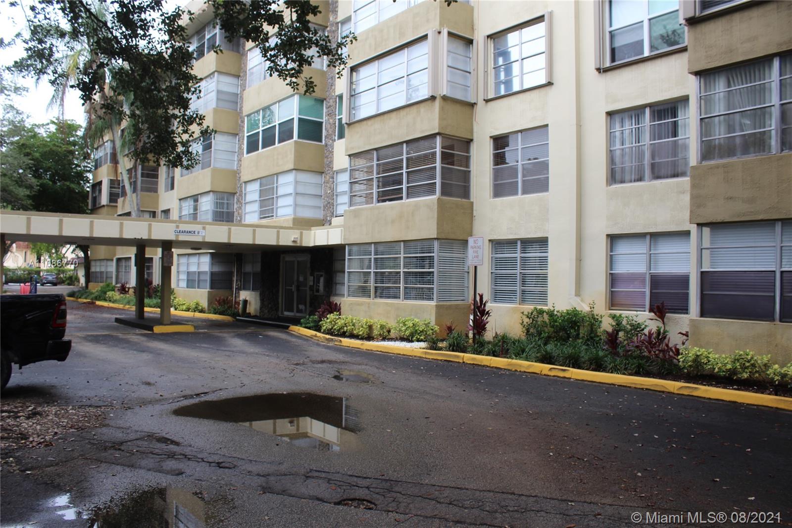 6700 Cypress Road, Unit 105 Plantation, FL 33317 - Photo 26 of 26 a front view of a building with a yard