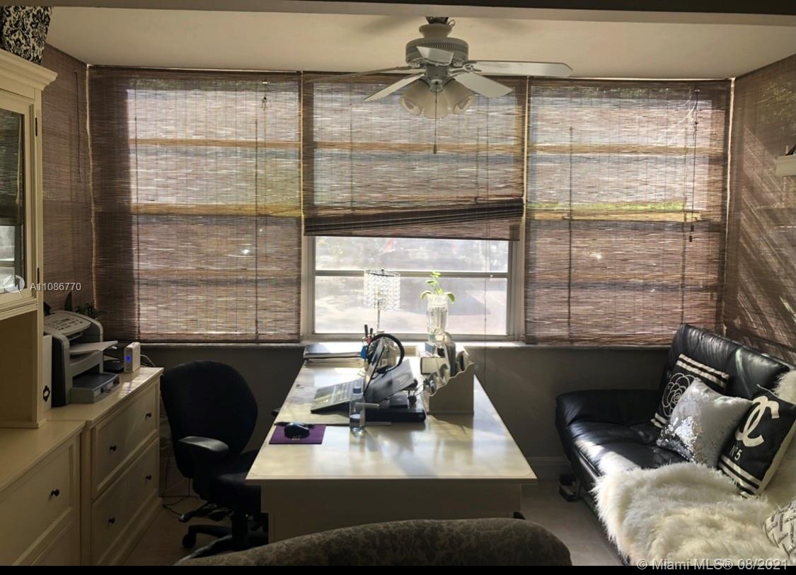 6700 Cypress Road, Unit 105 Plantation, FL 33317 - Photo 7 of 26 a view of a workspace with furniture and a window