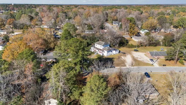 a view of a yard with trees