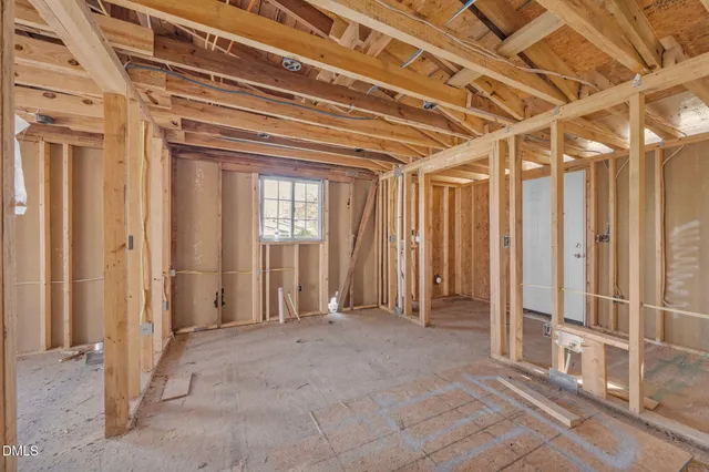 a bathroom with a shower and a glass door
