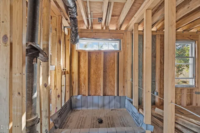 a view of a hallway with wooden floors