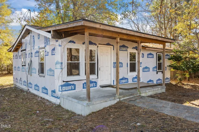 a front view of a house with large windows
