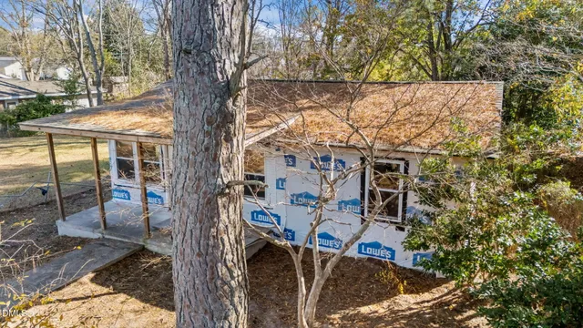 a view of a patio with wooden fence