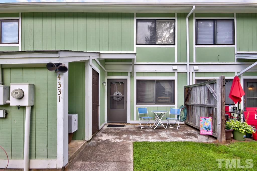 4331 Lake Ridge Drive, Unit NONE Raleigh, NC 27604 - Photo 2 of 14 a view of small house with a yard and sitting area