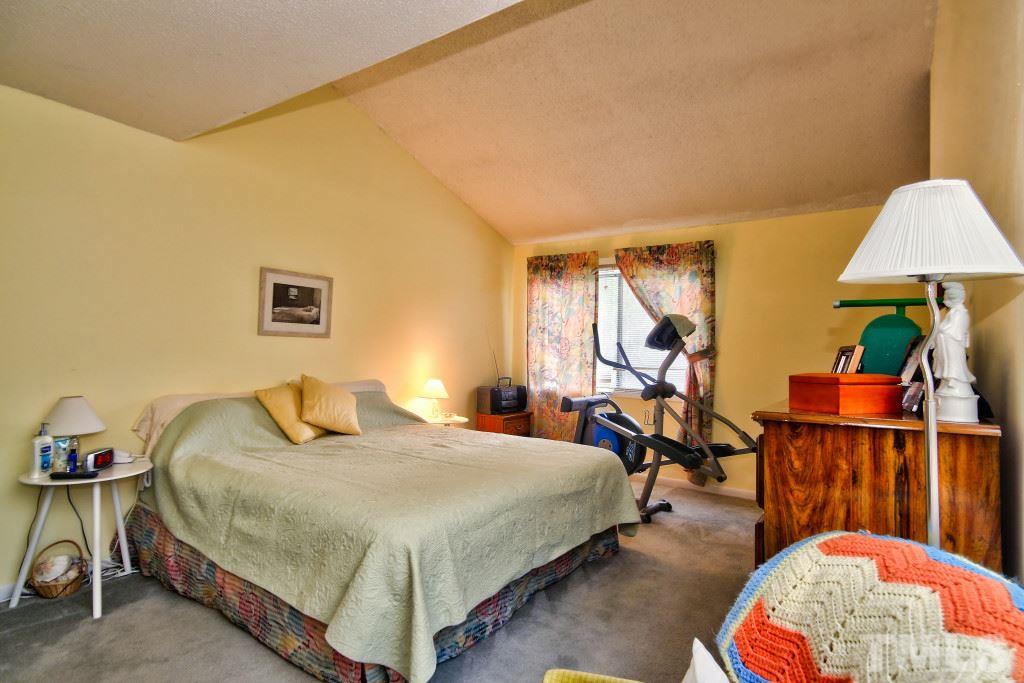4331 Lake Ridge Drive, Unit NONE Raleigh, NC 27604 - Photo 10 of 14 a bedroom with bed and a lamp