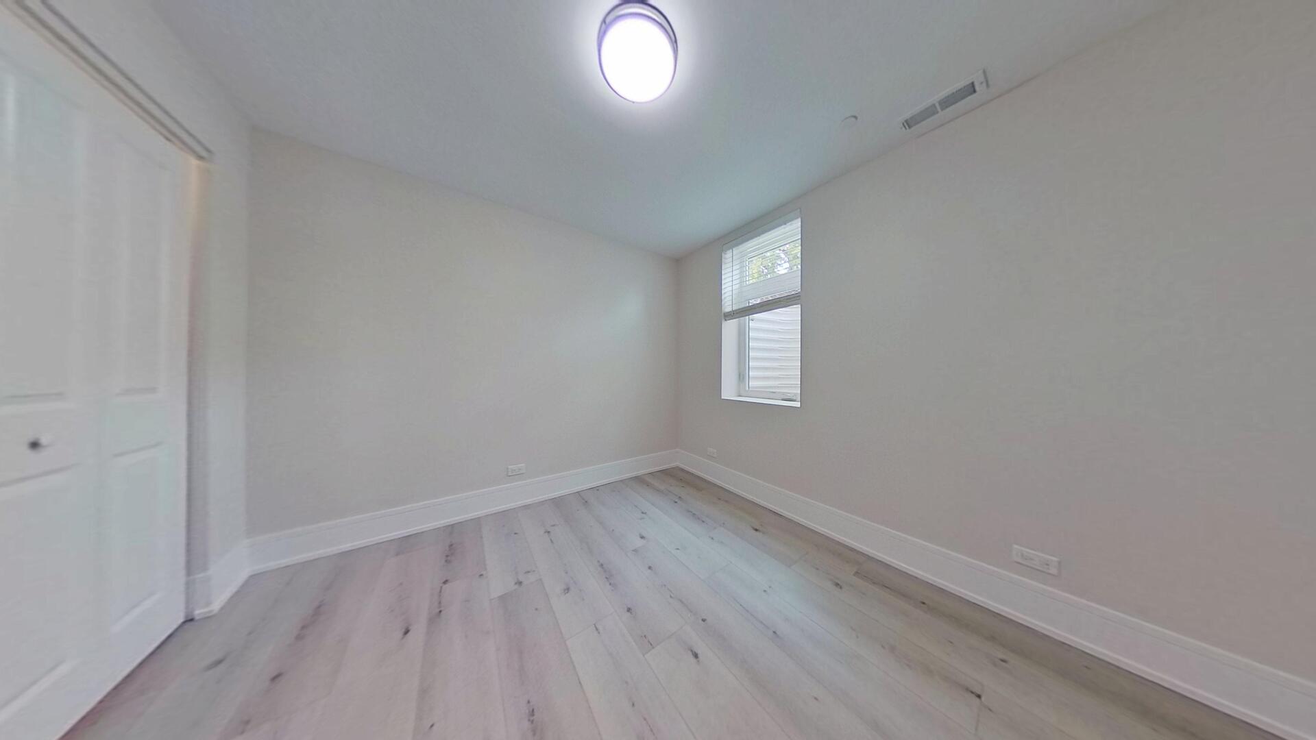 4000 Forest Avenue, Unit 2 Brookfield, IL 60513 - Photo 12 of 15 an empty room with wooden floor and windows