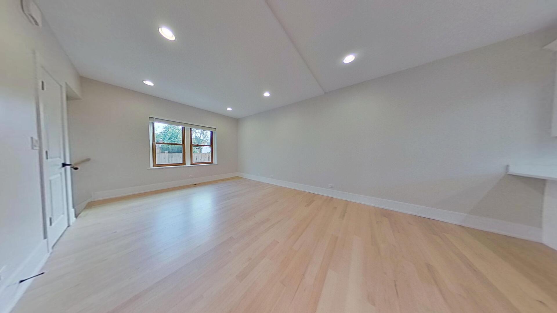 4000 Forest Avenue, Unit 2 Brookfield, IL 60513 - Photo 5 of 15 an empty room with wooden floor and windows
