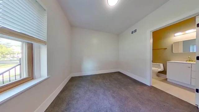 a view of a kitchen with a sink and cabinet