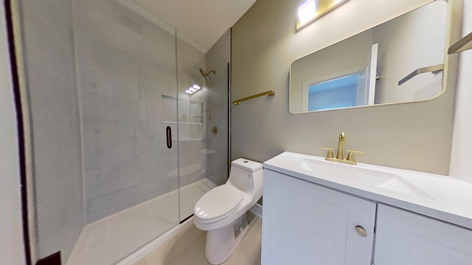 4000 Forest Avenue, Unit 2 Brookfield, IL 60513 - Photo 9 of 15 a bathroom with a sink a toilet and shower