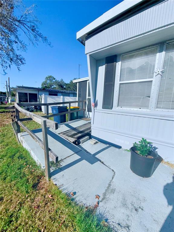 1370 County Drive Tavares, FL 32778 - Photo 11 of 12 a view of a house with backyard and sitting area