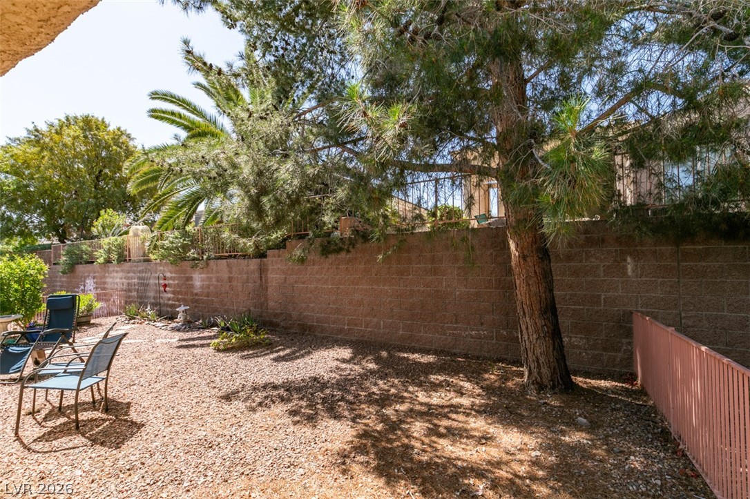 2187 Chapman Ranch Drive Henderson, NV 89012 - Photo 24 of 26 This spacious yard offers a serene retreat, perfect for relaxation and outdoor activities.