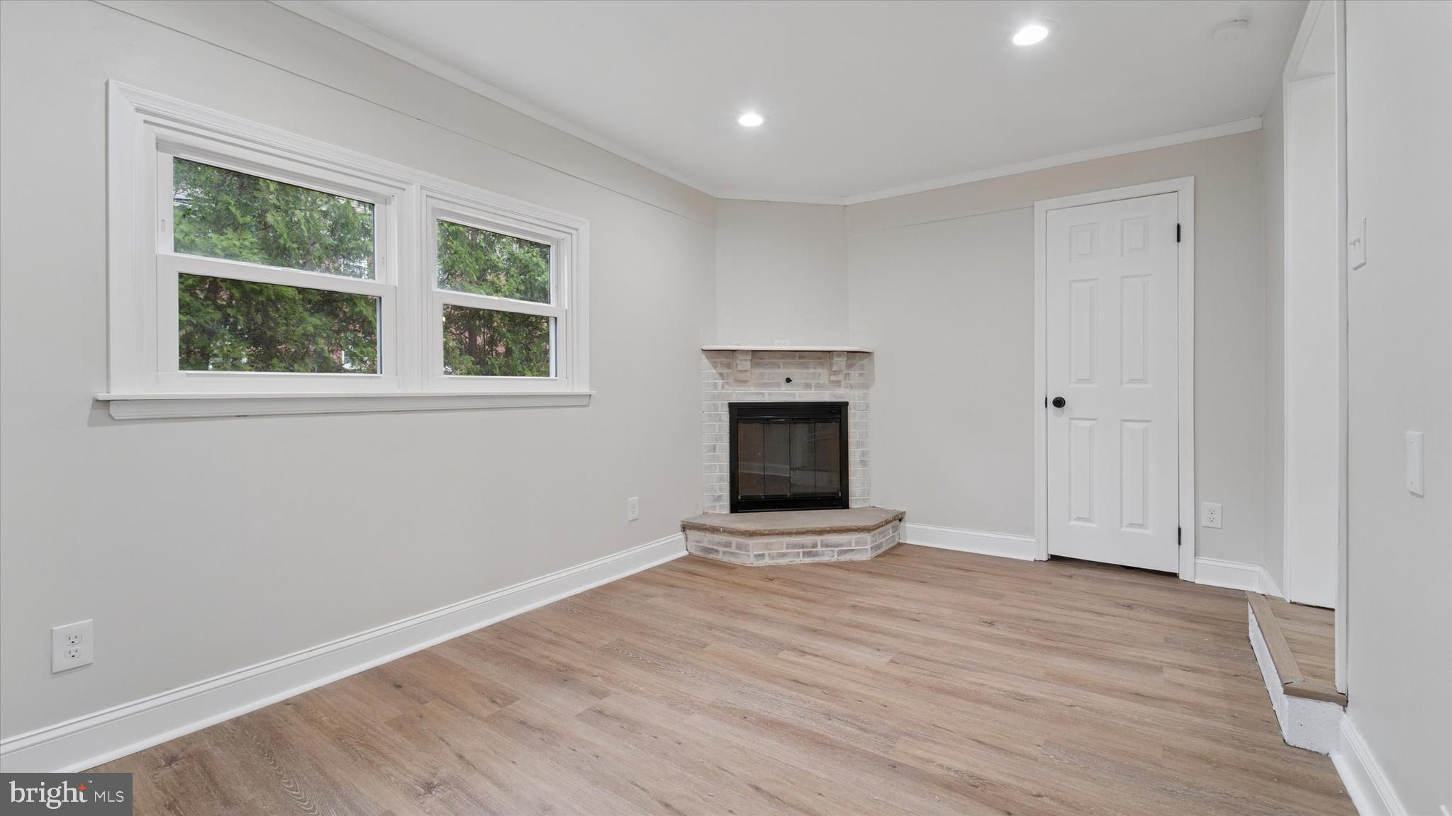 21 Fairview Road Springfield, PA 19064 - Photo 14 of 25 a view of an empty room with wooden floor and a window