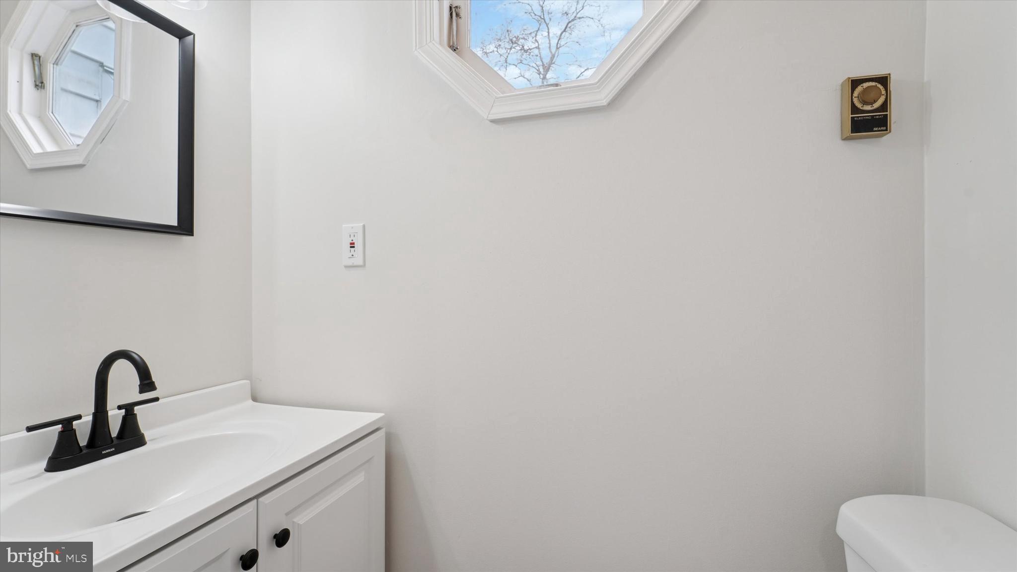 21 Fairview Road Springfield, PA 19064 - Photo 15 of 25 a bathroom with a toilet and a sink