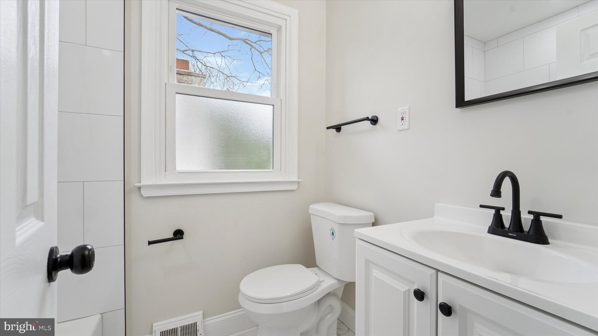 21 Fairview Road Springfield, PA 19064 - Photo 18 of 25 a bathroom with a toilet sink and mirror