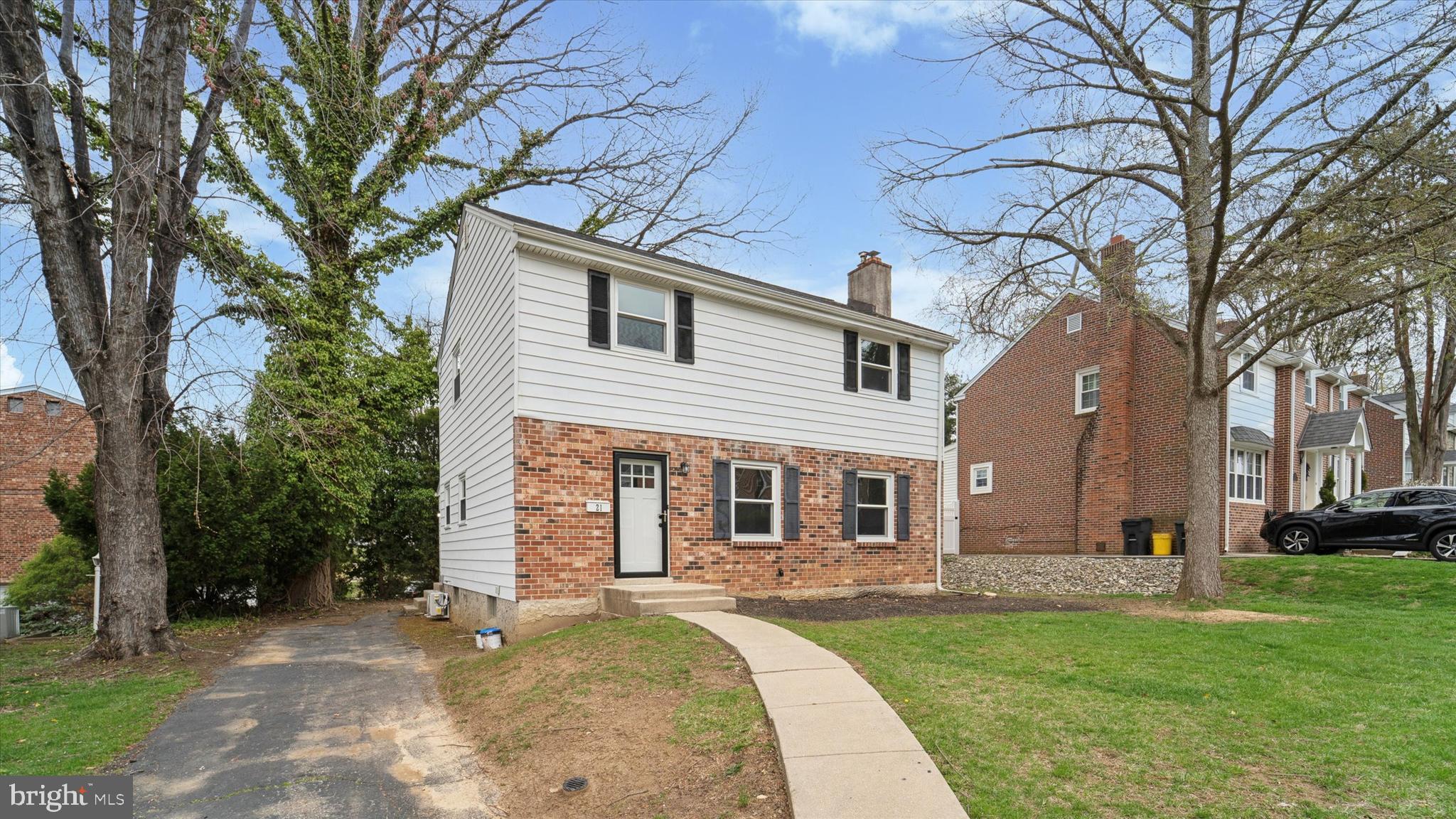 21 Fairview Road Springfield, PA 19064 - Photo 2 of 25 a front view of a house with a garden and trees