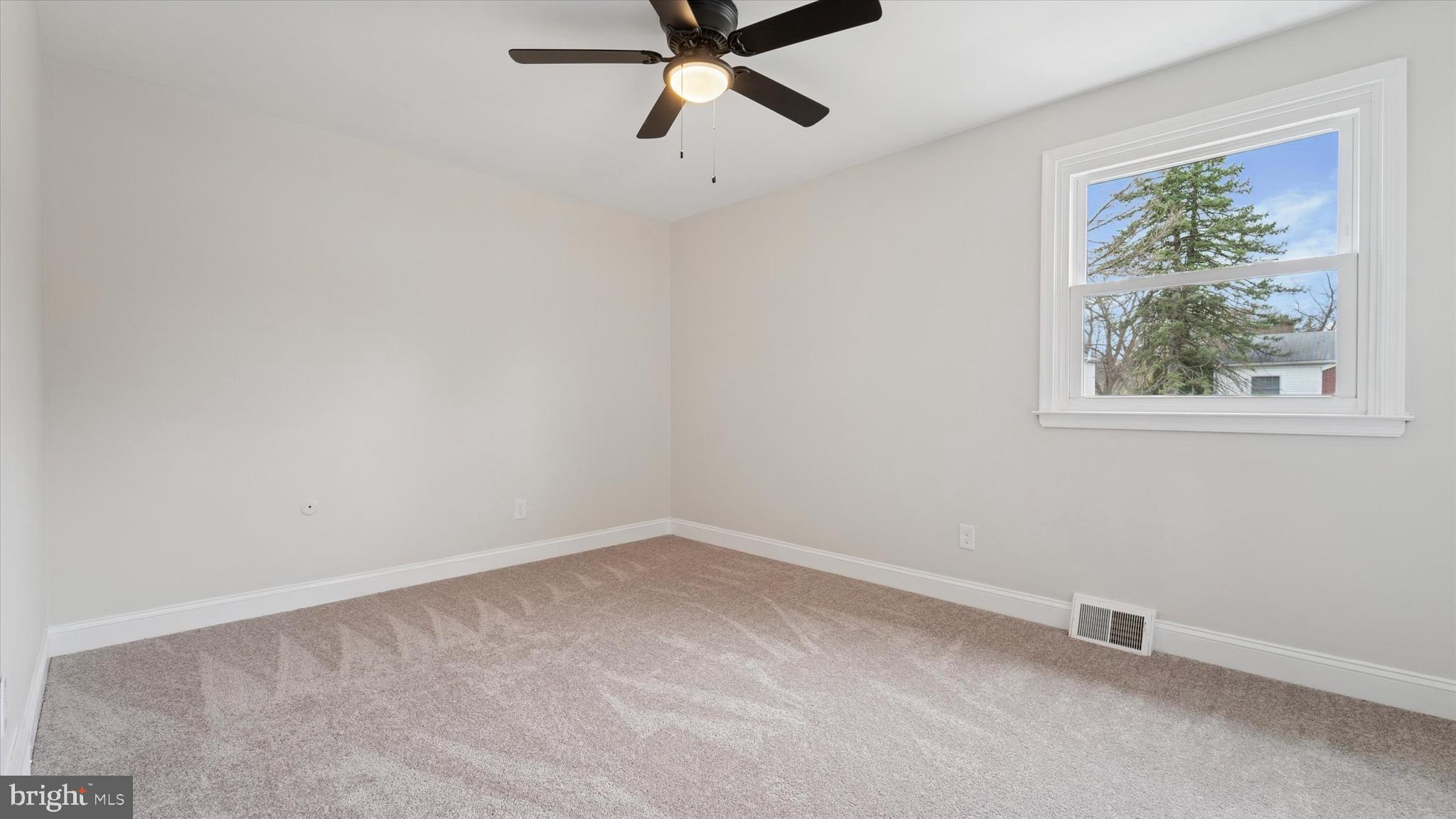 21 Fairview Road Springfield, PA 19064 - Photo 22 of 25 a view of a room with a window and a ceiling fan
