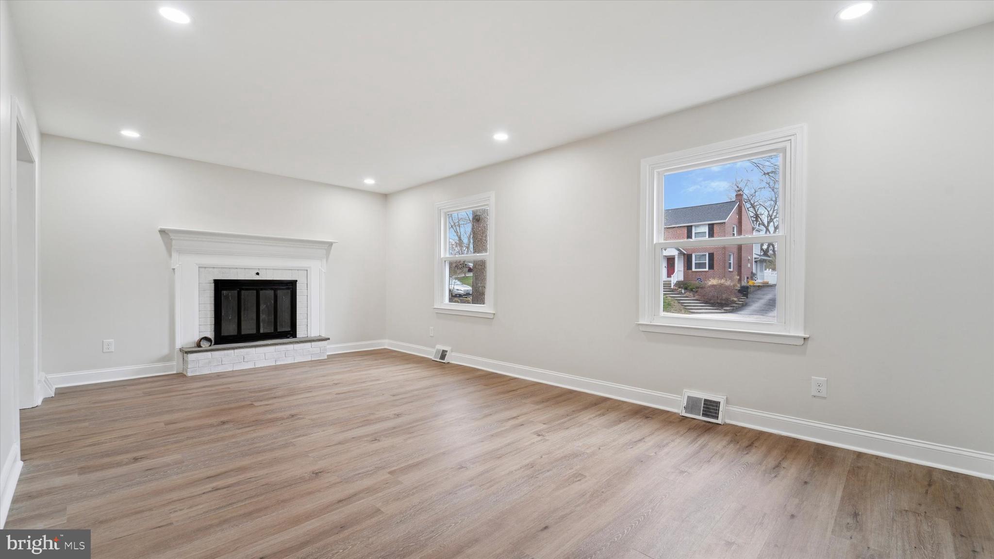 21 Fairview Road Springfield, PA 19064 - Photo 3 of 25 wooden floor in an empty room with a window