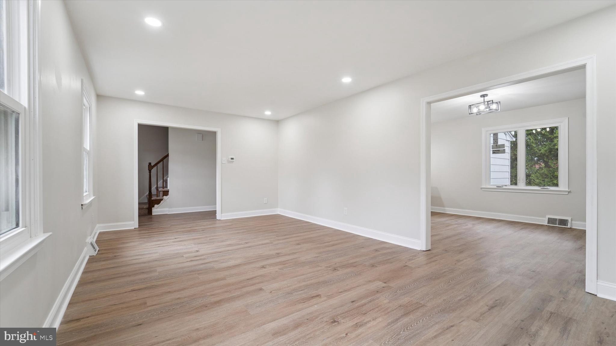21 Fairview Road Springfield, PA 19064 - Photo 4 of 25 an empty room with wooden floor and windows