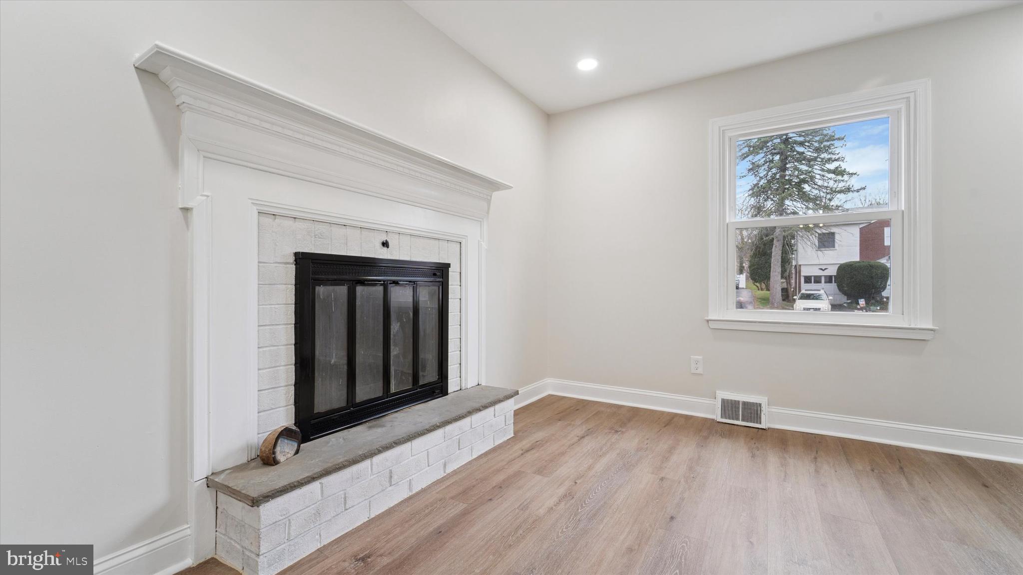 21 Fairview Road Springfield, PA 19064 - Photo 5 of 25 an entryway with wooden floor and cabinet