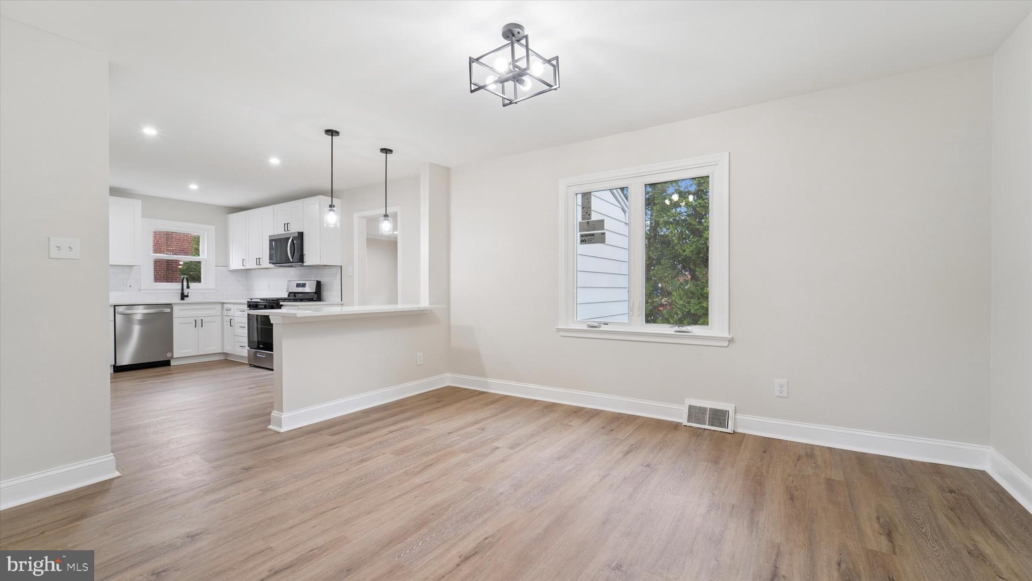 21 Fairview Road Springfield, PA 19064 - Photo 6 of 25 a view of kitchen with wooden floor and window